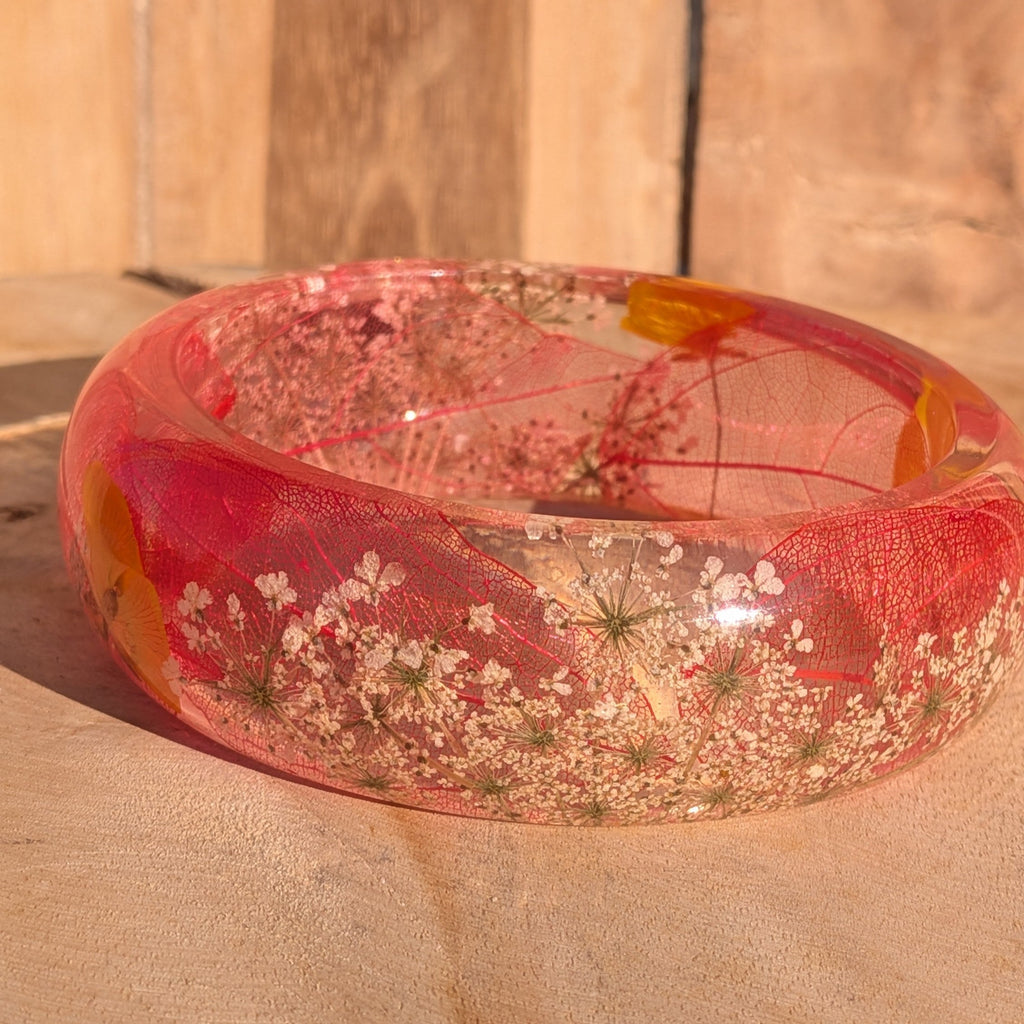 Resin bangle with red skeleton leaf and Queen Anne's Lace – side view showing domed profile – EL-Creations