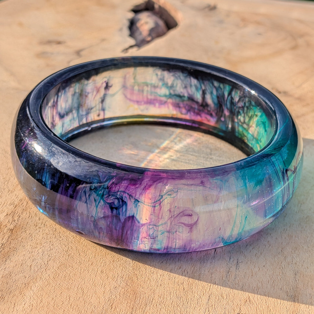 Close-up of purple and teal fluid art resin bracelet – EL-Creations