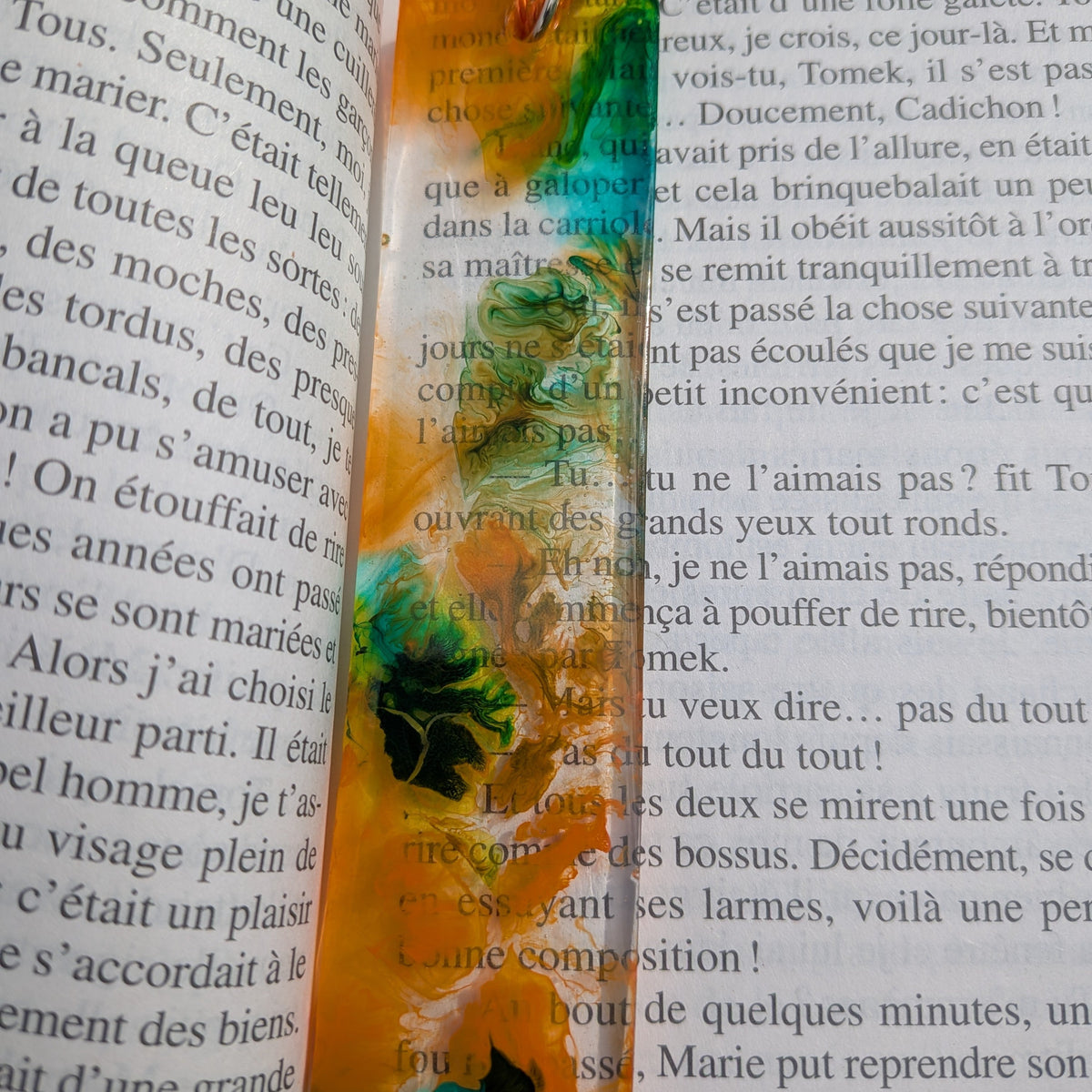 Close-up of orange teal resin bookmark fluid art pattern – EL-Creations