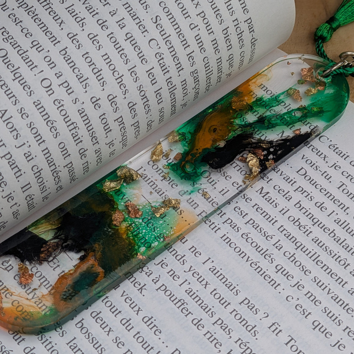 Handmade emerald green resin bookmark with gold leaf on open book – EL-Creations