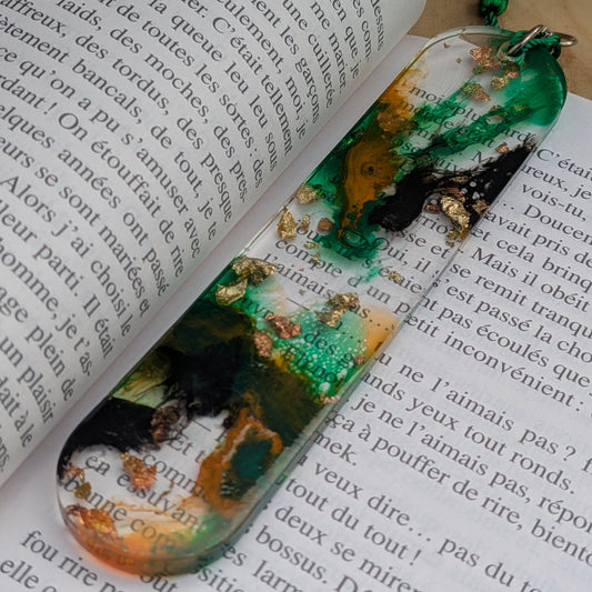 Resin bookmark with green tassel keychain ring standing upright on book – EL-Creations