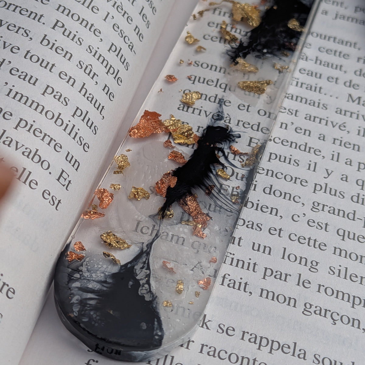 Ink storm resin bookmark with black tassel keychain on open book – EL-Creations