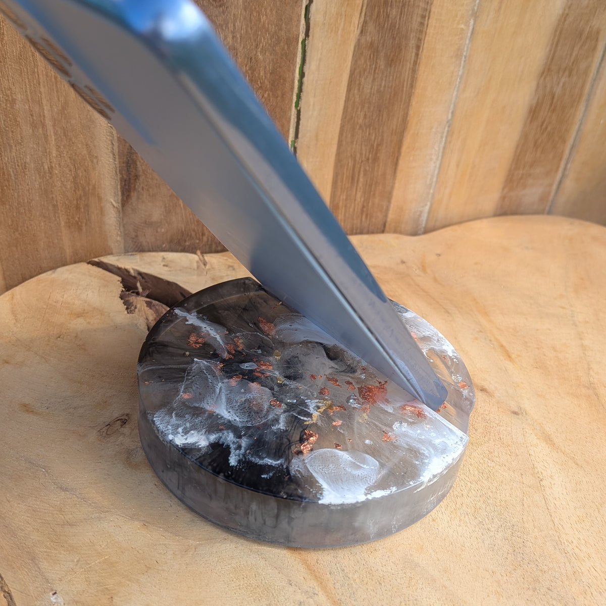 Handmade resin phone holder supporting a smartphone upright - EL-Creations
