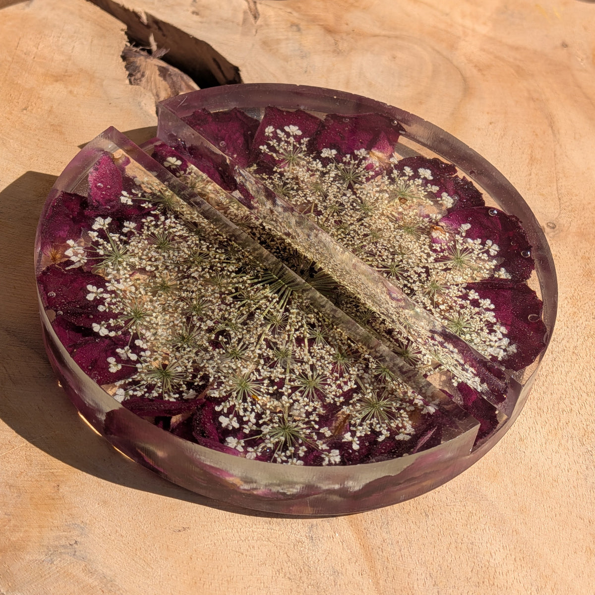 Clear epoxy resin phone stand featuring white Queen Anne’s lace and rose petals - EL-Creations