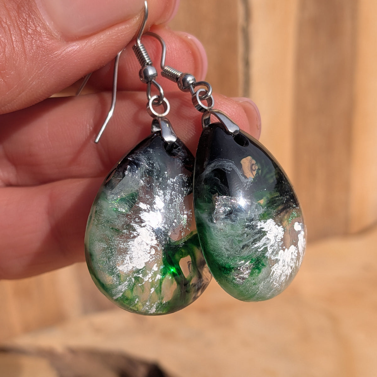 Translucent green and black teardrop earrings held by stainless steel hooks, EL-Creations
