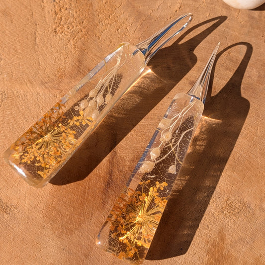 Side view of autumn resin earrings with golden Queen Anne's lace and skeleton leaf veins, EL-Creations