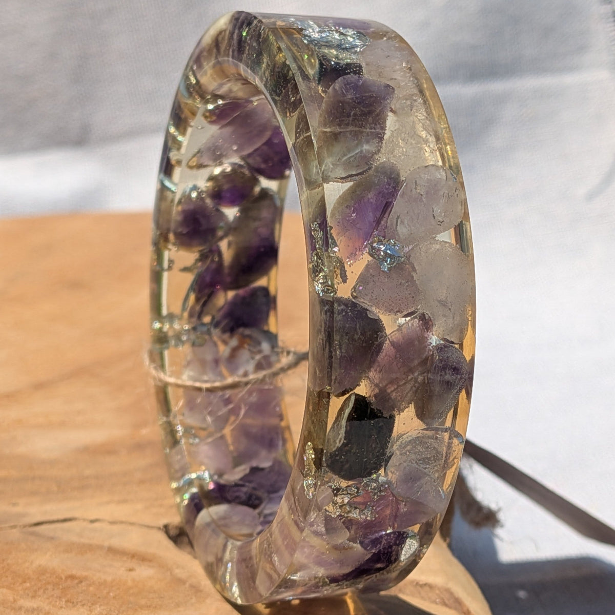 Top view of amethyst crystal resin bangle with silver flakes by EL-Creations