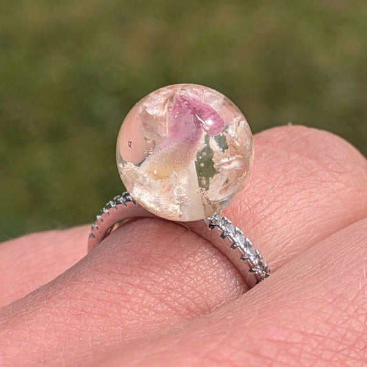 Real baby's breath and pink carnation resin sphere ring worn on hand by EL-Creations