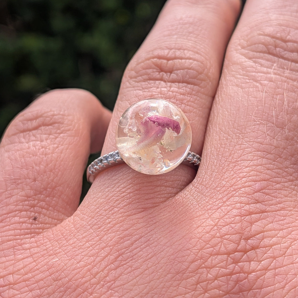 Adjustable sterling silver CZ ring with clear resin flower sphere on finger by EL-Creations
