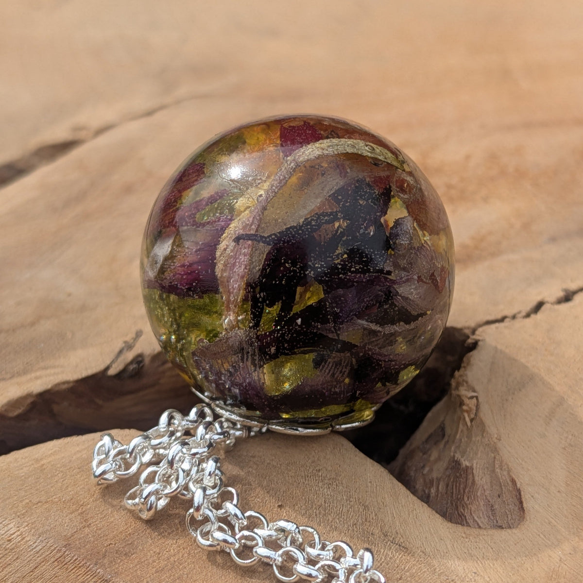 Nature inspired moss and tulip resin sphere necklace on driftwood by EL-Creations