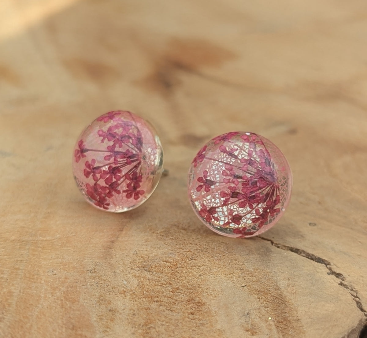 Delicate pink skeleton leaf resin stud earrings on stone surface, EL Creations
