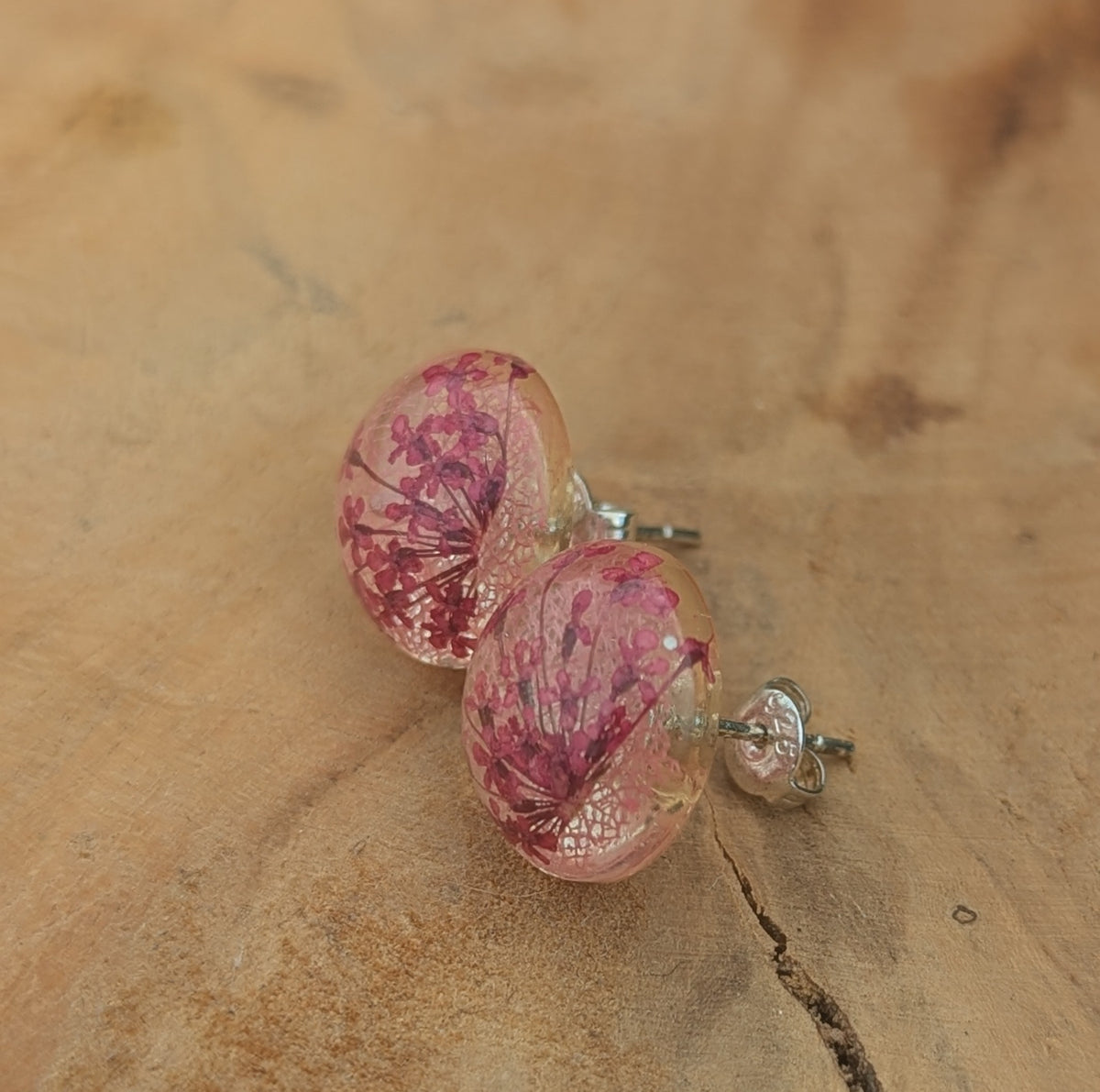 Handmade pink skeleton leaf resin earrings worn on ear, everyday botanical jewelry EL Creations Belgium