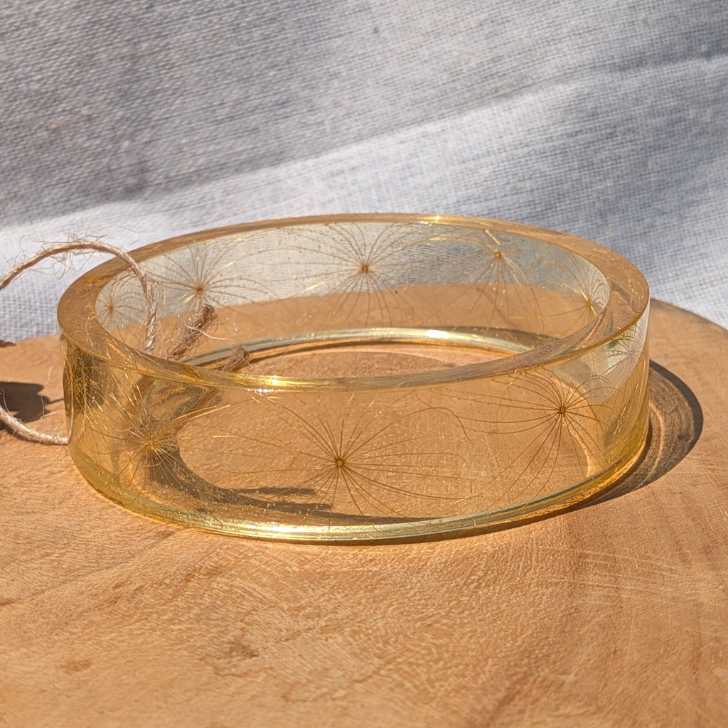 Close-up of fine wild seeds inside clear golden resin bangle by EL-Creations